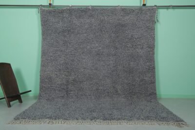 Handmade Moroccan gray wool rug with traditional Beni Ourain tribal patterns, crafted by skilled Berber artisans from 100% natural lamb wool, featuring a soft, durable pile perfect for living rooms and bedrooms with modern or rustic decor