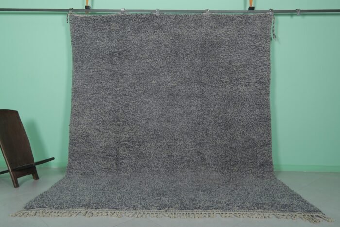 Handmade Moroccan gray wool rug with traditional Beni Ourain tribal patterns, crafted by skilled Berber artisans from 100% natural lamb wool, featuring a soft, durable pile perfect for living rooms and bedrooms with modern or rustic decor