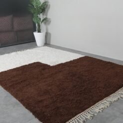 contemporary handmade Moroccan rug in ivory and brown, showing Berber craftsmanship and clean lines.