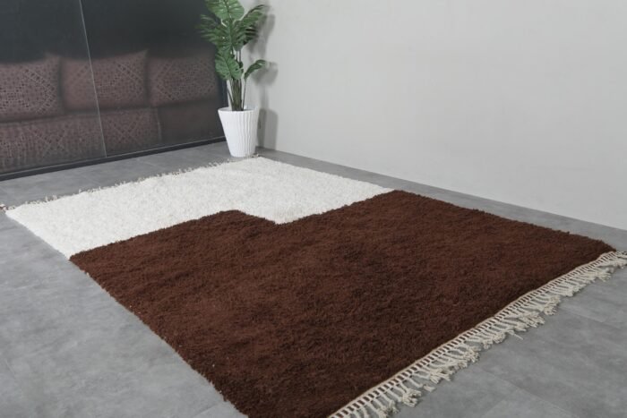 contemporary handmade Moroccan rug in ivory and brown, showing Berber craftsmanship and clean lines.
