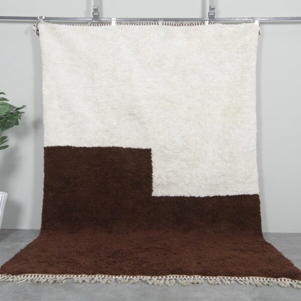 Handwoven Moroccan Beni Ourain rug in contemporary ivory and brown colors, crafted from 100% natural lamb wool by Berber artisans.