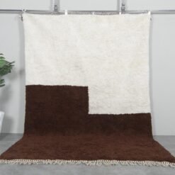 Handwoven Moroccan Beni Ourain rug in contemporary ivory and brown colors, crafted from 100% natural lamb wool by Berber artisans.