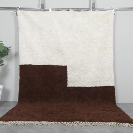 Handwoven Moroccan Beni Ourain rug in contemporary ivory and brown colors, crafted from 100% natural lamb wool by Berber artisans.