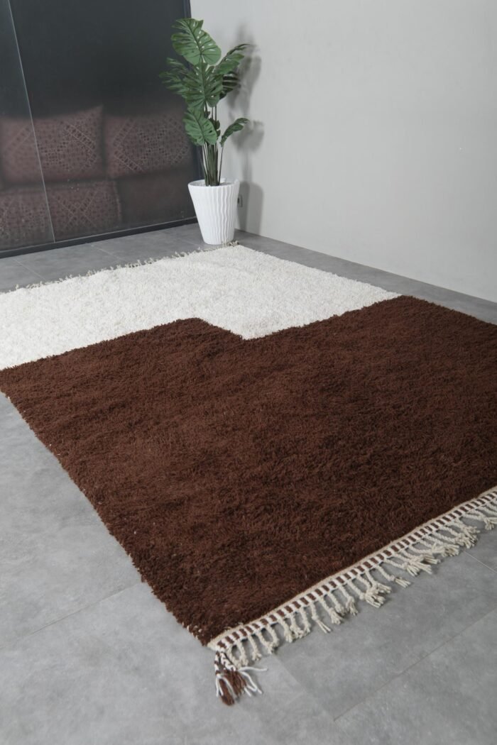 ivory and brown Moroccan Beni Ourain rug with symmetrical pattern and soft wool detail.