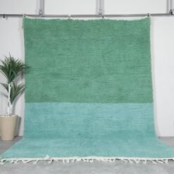 Minimalist Moroccan rug hand-knotted in forest green and soft aqua blue, made from 100% wool by Berber artisans.