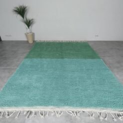 hand-knotted Moroccan Beni Ourain rug featuring earthy green and light aqua blue tones.
