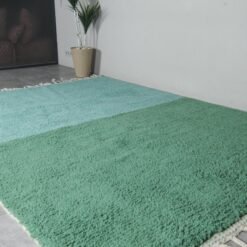 Moroccan wool rug in forest green and aqua, showcasing clean design and artisanal quality.
