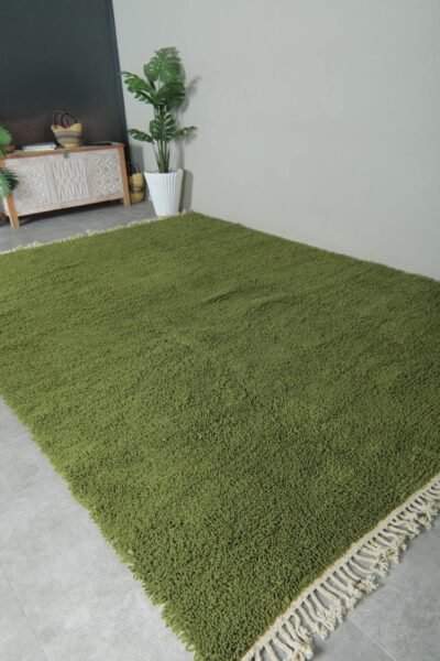 Moroccan olive green Beni Ourain rug showing its clean lines, deep earthy color, and handwoven texture. Perfect for floor styling or as an artistic wall hanging.