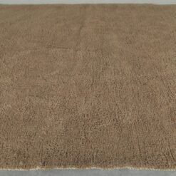 highlighting thick natural wool fibers and hand-knotted craftsmanship of Warm Caramel Brown Moroccan Rug