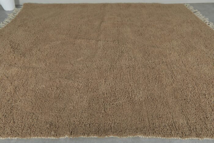 highlighting thick natural wool fibers and hand-knotted craftsmanship of Warm Caramel Brown Moroccan Rug