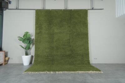 Authentic handmade Moroccan olive green Beni Ourain rug crafted with 100% natural lamb’s wool by skilled Berber women artisans. This lush olive green wool rug adds earthy elegance and cultural warmth to modern and rustic interiors. Perfect for living rooms, bedrooms, and wall décor.