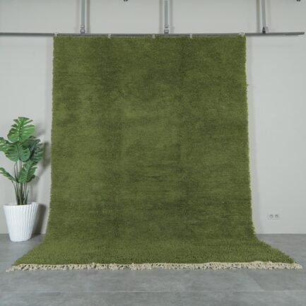 Authentic handmade Moroccan olive green Beni Ourain rug crafted with 100% natural lamb’s wool by skilled Berber women artisans. This lush olive green wool rug adds earthy elegance and cultural warmth to modern and rustic interiors. Perfect for living rooms, bedrooms, and wall décor.