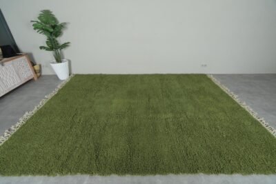 Moroccan olive green Beni Ourain rug revealing detailed hand-knotting and plush wool texture. Emphasizes the rug’s authentic craftsmanship and softness for warm, inviting interiors