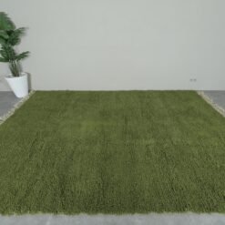 Moroccan olive green Beni Ourain rug revealing detailed hand-knotting and plush wool texture. Emphasizes the rug’s authentic craftsmanship and softness for warm, inviting interiors