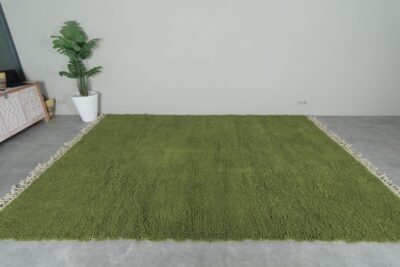 hand-knotted Moroccan olive green Beni Ourain rug showcasing the rich wool texture and plush pile. Handmade in the Atlas Mountains, this rug brings natural color and artisan quality to your home decor.