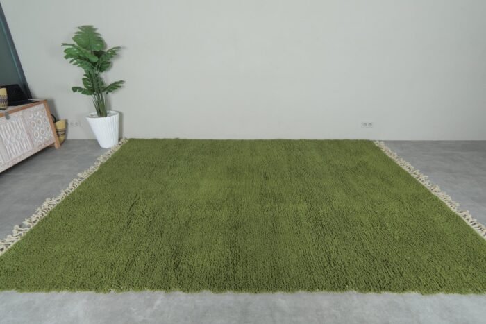 hand-knotted Moroccan olive green Beni Ourain rug showcasing the rich wool texture and plush pile. Handmade in the Atlas Mountains, this rug brings natural color and artisan quality to your home decor.