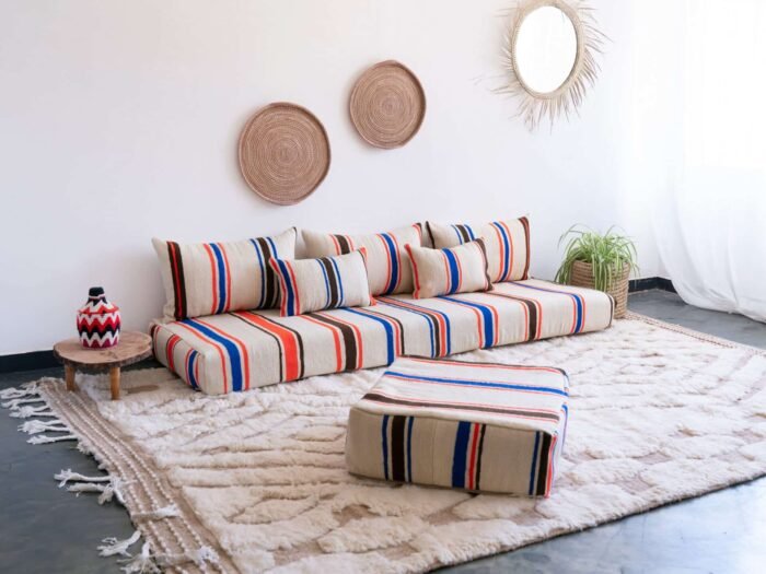 Bohemian-style living space with Moroccan striped floor sofa