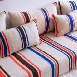 Accent pillows in cream wool with blue and orange Berber stripes