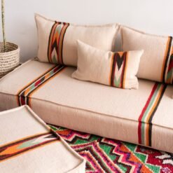 Moroccan floor seating set displayed in bright natural light showcasing embroidery details