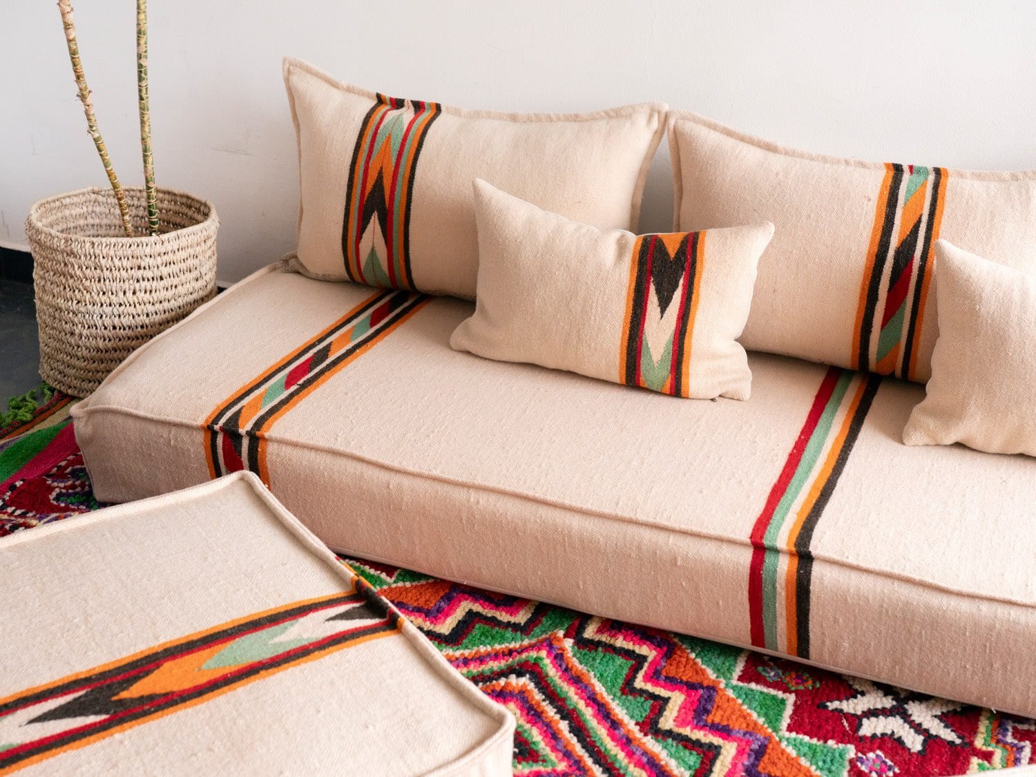 Moroccan floor seating set displayed in bright natural light showcasing embroidery details
