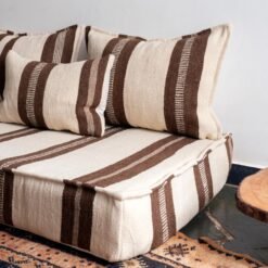 Bohemian room setup with Moroccan ivory and brown floor cushions