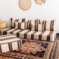 Side view of Moroccan wool cushion cover in ivory with brown accents