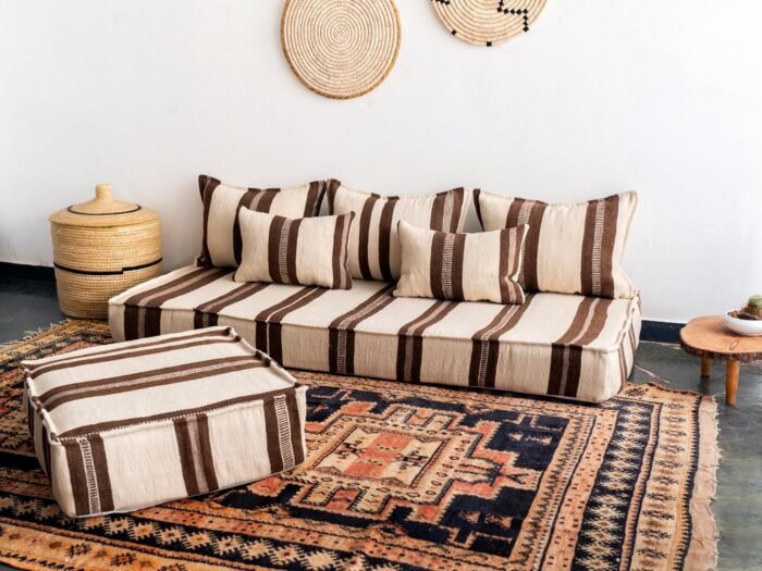 Side view of Moroccan wool cushion cover in ivory with brown accents