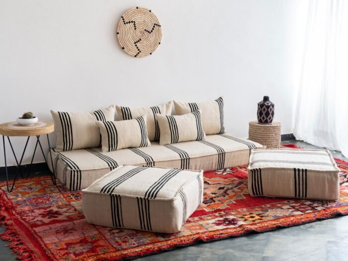 Cozy living space styled with Moroccan cream and black cushions