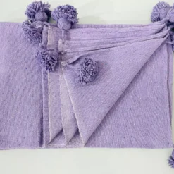 Folded Moroccan purple blanket with size comparison layout