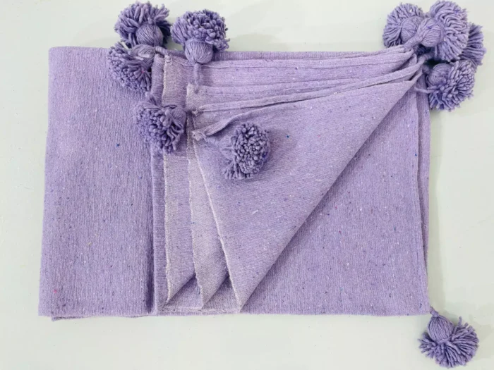 Folded Moroccan purple blanket with size comparison layout
