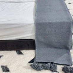 Grey blanket in natural light, showing texture and softness