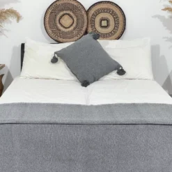 Grey cotton throw paired with neutral Moroccan home accessories