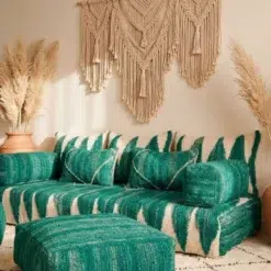Handwoven green Moroccan floor sofa covers displayed with two matching square poufs