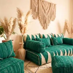 Handwoven green Moroccan floor couch covers with ivory geometric patterns and matching pillows