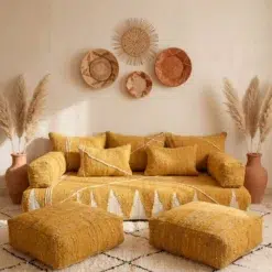 Mustard Moroccan floor sofa covers displayed with ivory patterns and two matching floor poufs