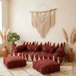 Red Moroccan floor sofa covers with ivory patterns, matching pillows, armrests and two floor poufs