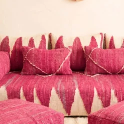 Close-up of pink and ivory chevron pattern on Moroccan floor sofa pillows