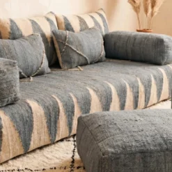 Close-up of handwoven gray and ivory chevron fabric on Moroccan floor sofa