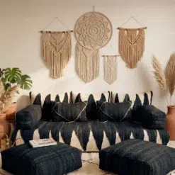 Black and ivory Moroccan floor sofa covers with handwoven wool cushions and matching poufs