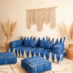Handwoven blue Moroccan floor couch with back pillows and matching armrest covers