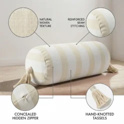 Cream and white striped bolster pillow showing woven texture reinforced seam concealed zipper and tassels