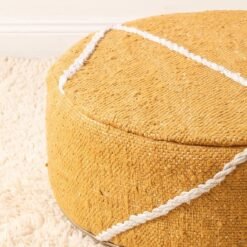 Close-up of mustard yellow geometric cotton pouf showing woven texture and raised decorative lines