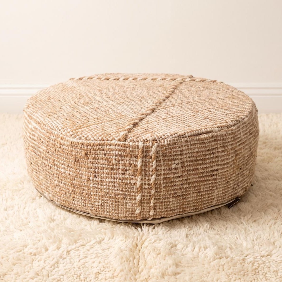 Natural beige round cotton pouf with raised diagonal seam, 50 cm diameter and 20 cm height