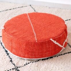 Orange round cotton pouf with fine ivory stitch lines