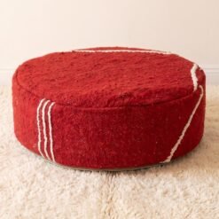 Red round cotton pouf with contrasting ivory stripes on the top and sides