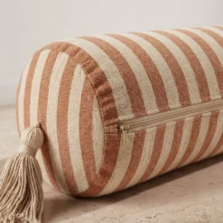Brown cream striped bolster pillow cover showing zipper closure